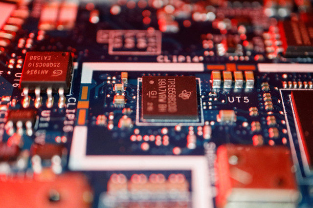 FILE PHOTO: Semiconductor chips are visible on a computer circuit board in this illustration picture taken on February 25, 2022. REUTERS/Florence Lo/Illustration/File Photo