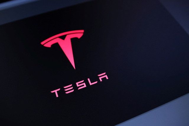 The Tesla logo is visible in this illustration taken on July 23, 2025. REUTERS/Dado Ruvic/Illustration