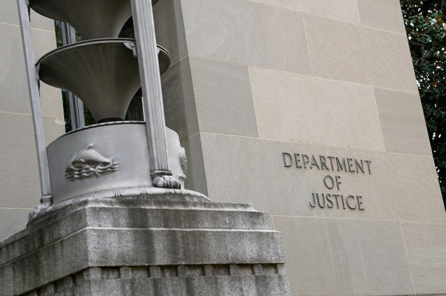 A sign on the wall of the U.S. Department of Justice building in Washington, D.C., U.S., November 14, 2025. REUTERS/Elizabeth Frantz