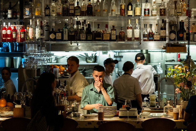 Employees work in the open kitchen of a restaurant in the Patriarch's Ponds neighbourhood in central Moscow, Russia, on July 11, 2025. REUTERS/Maxim Shemetov