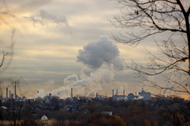 Emissions billow from an industrial area housing steel companies in Hamilton, Ontario, Canada, on March 13, 2025. REUTERS/Carlos Osorio