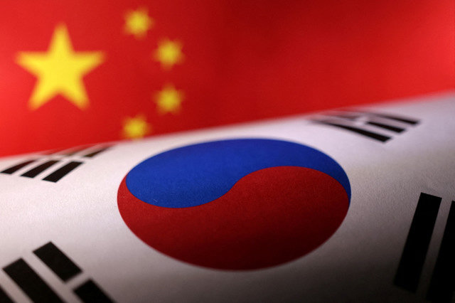 Printed Chinese and South Korean flags are seen in this illustration, July 21, 2022. REUTERS/Dado Ruvic/Illustration