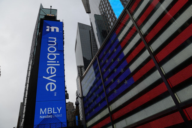 The listing of Mobileye Global Inc., Intel Corp's self-driving unit, is displayed on a jumbotron at the Nasdaq MarketSite in Times Square, New York City, U.S., on October 26, 2022. REUTERS/Shannon Stapleton