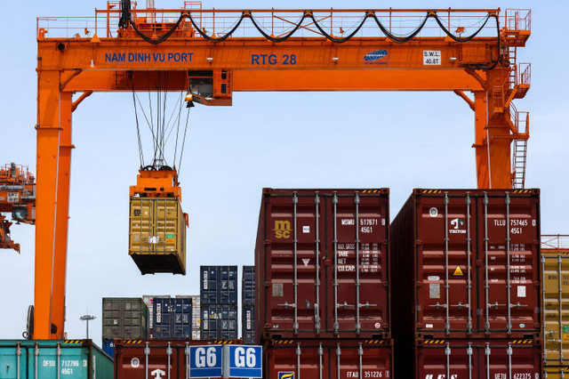 A container is loaded onto a cargo ship at Hai Phong port in Vietnam on April 16, 2025. REUTERS/Athit Perawongmetha
