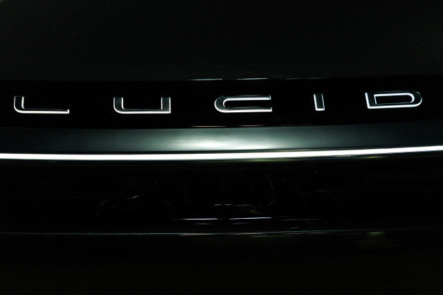 The LUCID logo is displayed on their electric Gravity vehicle at the LA Auto show "AutoMobility LA" in Los Angeles, California, U.S. on November 20, 2025. REUTERS/Mike Blake
