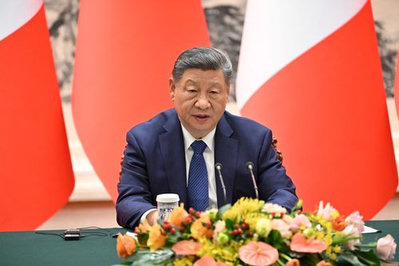 Histórica reunión en Pekín entre Xi y Martin