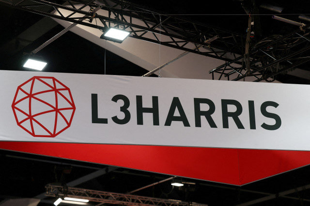 FILE PHOTO: An L3Harris logo is displayed above a stand on the first day of the Indo Pacific International Maritime Exposition in Sydney, Australia, November 4, 2025. REUTERS/Hollie Adams/File Photo