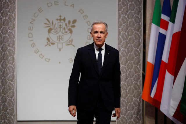 Canadian Prime Minister Mark Carney arrives at the Elysee Palace in Paris, France, for the Coalition of the Willing summit on January 6, 2026. YOAN VALAT/Pool via REUTERS