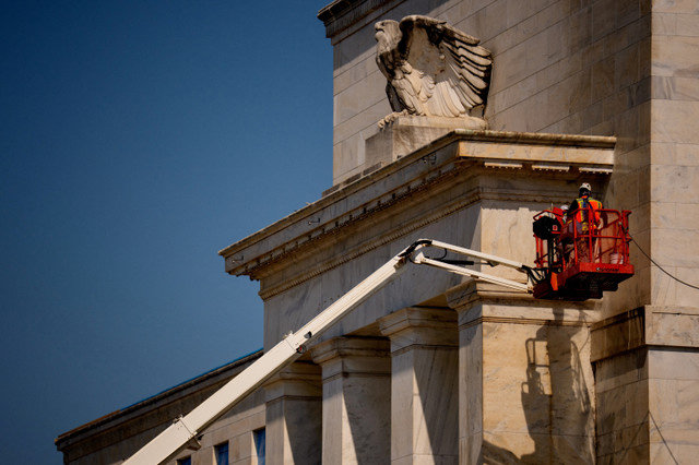 FILE PHOTO: The front facade of the Marriner S. Eccles Federal Reserve Board Building is seen as extensive renovations take place on it and the 1951 Constitution Avenue Building in Washington, D.C., U.S., on July 24, 2025. Andrew Harnik/Pool via REUTERS/File Photo