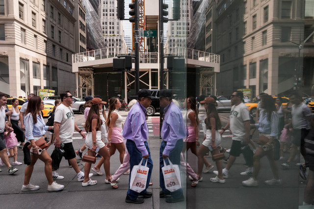 People walk on Fifth Avenue in New York City, U.S., August 7, 2025. REUTERS/Adam Gray