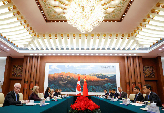 China's Foreign Minister Wang Yi attends a meeting with Canada's Minister of Foreign Affairs Anita Anand at the Great Hall of the People in Beijing on January 15, 2026, during the first visit by a Canadian Prime Minister to China since 2017. REUTERS/Carlos Osorio