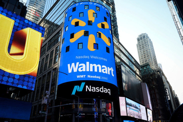 A screen displays the Walmart logo during the opening bell ceremony at the Nasdaq Market to celebrate the company’s listing transfer in New York City, U.S., on December 9, 2025. REUTERS/Brendan McDermid/File Photo