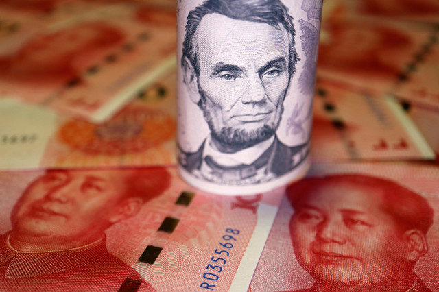 U.S. Dollar and Chinese Yuan banknotes are seen in this illustration picture taken June 14, 2022. REUTERS/Florence Lo/Illustration