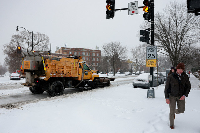 A snowplow truck works on the road as a major winter storm spreads across a large swath of the United States, in Washington, D.C., U.S., January 25, 2026. REUTERS/Jonathan Ernst