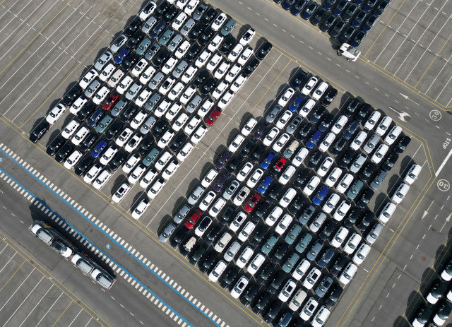 A drone view shows new cars parked, imported or waiting to be exported, in the port of Zeebrugge, Belgium, July 18, 2025. REUTERS/Yves Herman