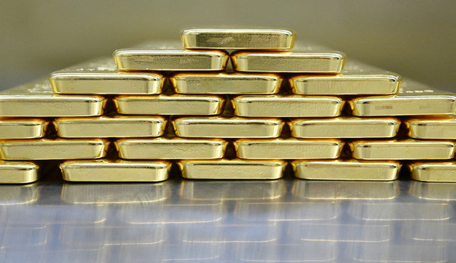 Gold bars are stacked in the safe deposit boxes room of the Pro Aurum gold house in Munich, Germany, January 10, 2025. REUTERS/Angelika Warmuth