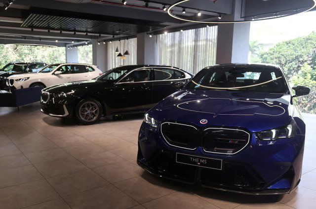FILE PHOTO: Cars are displayed inside a BMW showroom in Mumbai, India, January 8, 2026. REUTERS/Francis Mascarenhas/File Photo