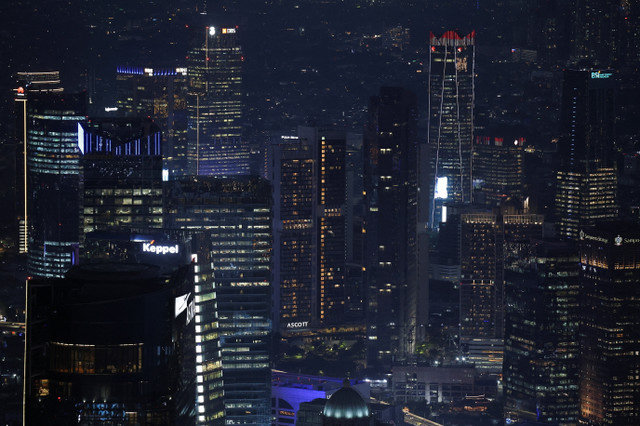 High-rise buildings are illuminated in the evening in Jakarta’s business district, Indonesia, November 4, 2025. REUTERS/Willy Kurniawan