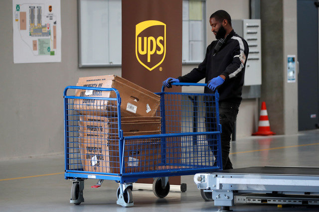 An United Parcel Service employee works at the new package sorting and delivery UPS hub in Corbeil-Essonnes and Evry, southern Paris, France, June 26, 2018. REUTERS/Charles Platiau/File Photo