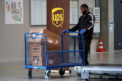 UPS Plans 30,000 Job Cuts and Raises Revenue Forecast