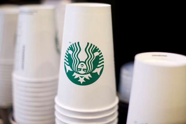 Branded Starbucks cups are stacked beside a counter in Philadelphia, Pennsylvania, U.S., on May 29, 2018. REUTERS/Mark Makela