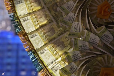 Indian rupee hits record low amid capital outflows