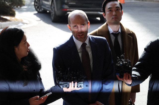 Interim CEO of Coupang's South Korean business Harold Rogers speaks to the media upon arrival for police questioning regarding a massive leak of local customer data at the Seoul Metropolitan Police Agency in Seoul, South Korea, January 30, 2026. REUTERS/Kim Hong-Ji