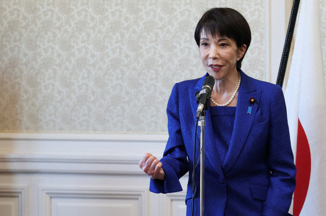 Japan's Prime Minister and ruling Liberal Democratic Party (LDP) leader Sanae Takaichi makes a fist as she addresses party lawmakers during a meeting ahead of the dissolution of the lower house in Tokyo, January 23, 2026. REUTERS/Issei Kato
