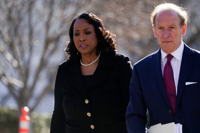 Federal Reserve Governor Lisa Cook, accompanied by lawyer Abbe Lowell, walks outside the U.S. Supreme Court in Washington, D.C., as justices consider President Donald Trump's effort to fire her, January 21, 2026. REUTERS/Nathan Howard