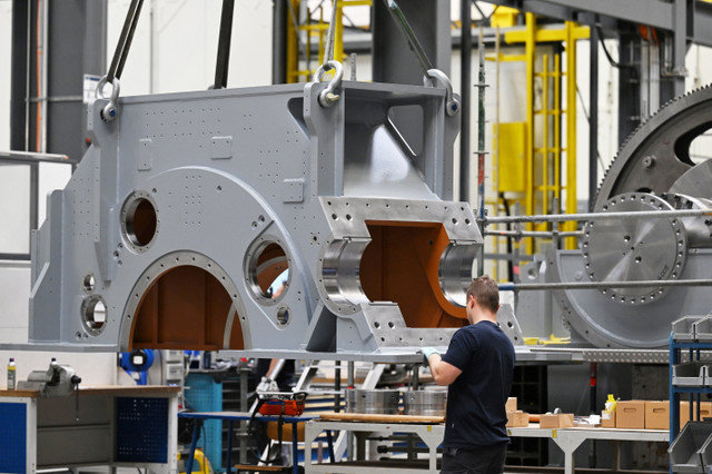 An employee works in the final assembly of gearbox production at the RENK Group, a leading global supplier of drive and gearbox technology for the defence industry, in Augsburg, Germany, November 20, 2025. REUTERS/Angelika Warmuth