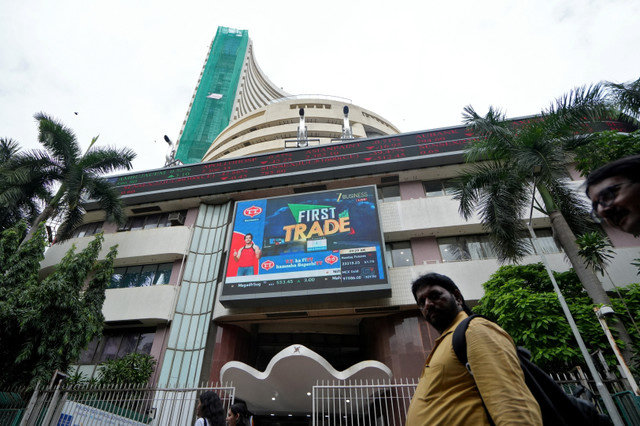 People walk past the Bombay Stock Exchange (BSE) building in Mumbai, India, August 1, 2025. REUTERS/Hemanshi Kamani