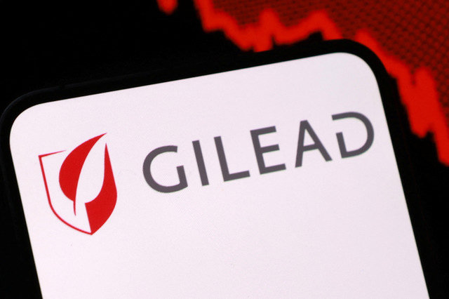 Gilead logo and a decreasing stock graph are seen in this illustration taken August 5, 2025. REUTERS/Dado Ruvic/Illustration