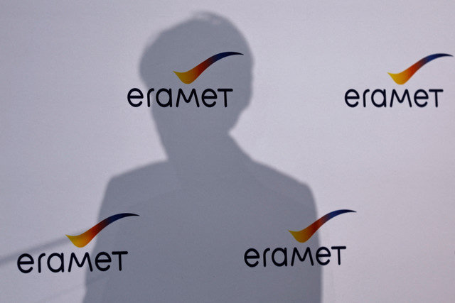 Christel Bories, Chief Executive Officer of Eramet, casts her shadow on a wall with Eramet logos as she delivers a speech during the inauguration of a battery recycling pilot plant for the ReLieVe Project (Recycling Li-ion Batteries for Electric Vehicles) by Eramet and Suez in Trappes, near Paris, France, November 14, 2023. REUTERS/Gonzalo Fuentes