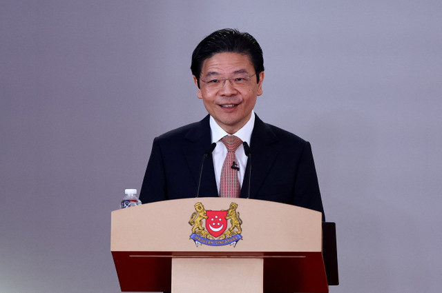 O primeiro-ministro de Singapura, Lawrence Wong, discursa durante a cerimônia de posse dos novos ministros do Gabinete de Singapura no Istana, em Singapura, em 23 de maio de 2025. REUTERS/Edgar Su/Pool