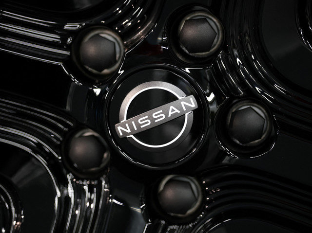 A Nissan logo is seen on the wheel hub of a new Nissan Leaf electric car during an event at the Nissan factory in Sunderland, Britain, December 16, 2025. REUTERS/Phil Noble