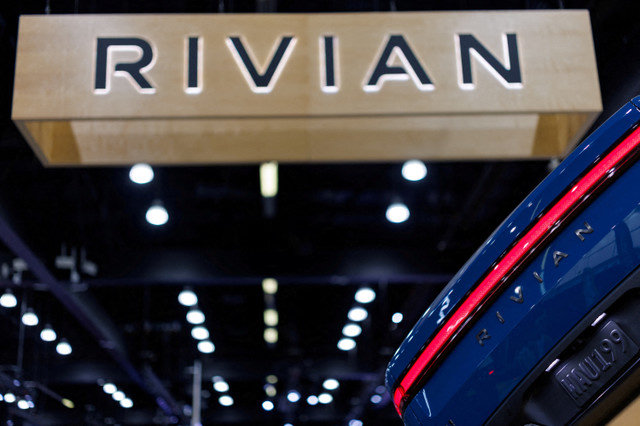 The logo of electric truck company Rivian is displayed at the "AutoMobility LA" auto show in Los Angeles, California, U.S., on November 20, 2025. REUTERS/Mike Blake/File Photo