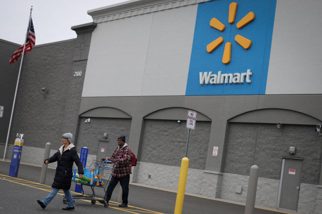 Customers leave a Walmart Supercenter retail store in North Bergen, New Jersey, U.S., November 21, 2025. REUTERS/Mike Segar/File Photo