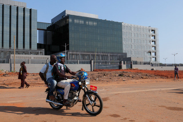 People pass Ghana's newly built Finance Ministry in Accra, Ghana, February 12, 2026. REUTERS/Francis Kokoroko
