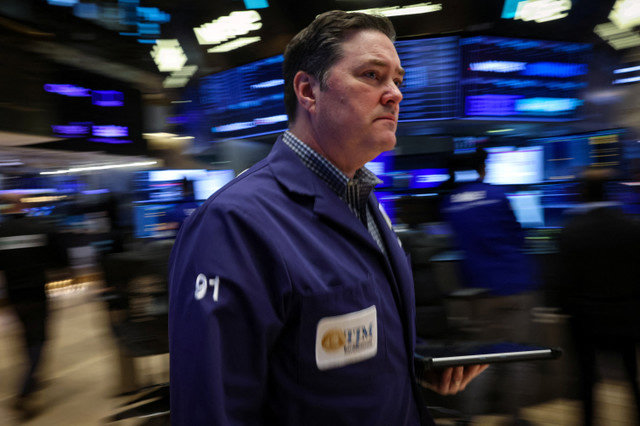 Traders work on the floor at the New York Stock Exchange (NYSE) in New York City, U.S., February 13, 2026. REUTERS/Brendan McDermid