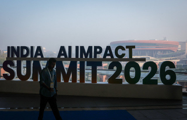 A visitor walks inside an exhibition hall at a venue for the India AI Impact Summit at Bharat Mandapam in New Delhi, India, February 19, 2026. REUTERS/Bhawika Chhabra