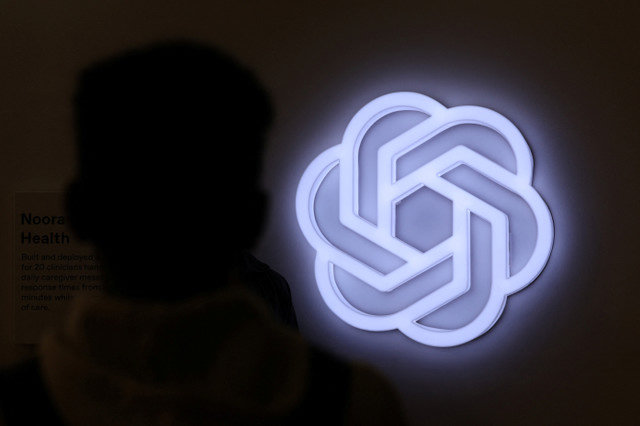 A person stands next to the logo of ChatGPT, an AI-powered chatbot by OpenAI, at Bharat Mandapam, one of the venues for the AI Impact Summit, in New Delhi, India, February 17, 2026. REUTERS/Bhawika Chhabra