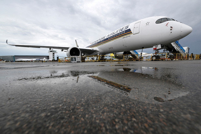 A Singapore Airlines plane is seen among aircraft in the static display at the Singapore Airshow in Singapore on February 16, 2022. REUTERS/Caroline Chia