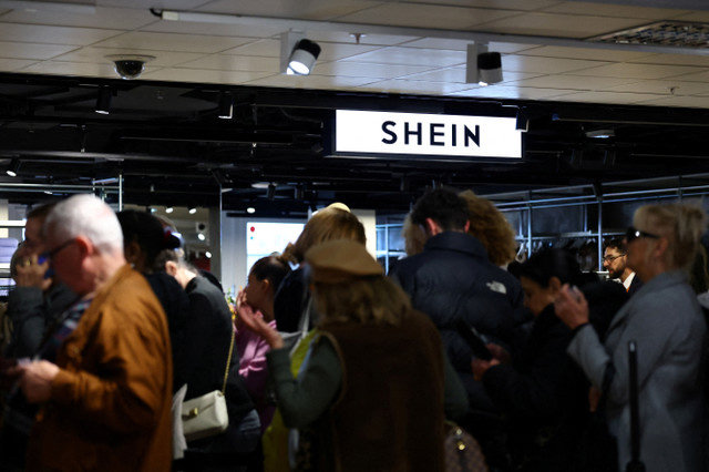 Customers queue to enter the first physical space of Chinese online fast-fashion retailer Shein on the day of its opening inside the Le BHV Marais department store in Paris, France, November 5, 2025. REUTERS/Sarah Meyssonnier/File Photo