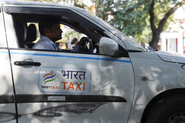A driver sits inside a Bharat Taxi cab as he waits for a ride in New Delhi, India, February 24, 2026. REUTERS/Bhawika Chhabra