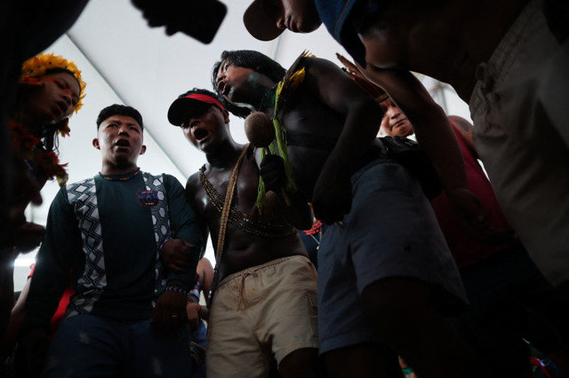 Indigenous people take part in a ritual during their occupation of the Cargill port terminal in Santarem, Brazil, on February 23, 2026, to protest plans to dredge the Tapajos river for grain exports. REUTERS/Adriano Machado