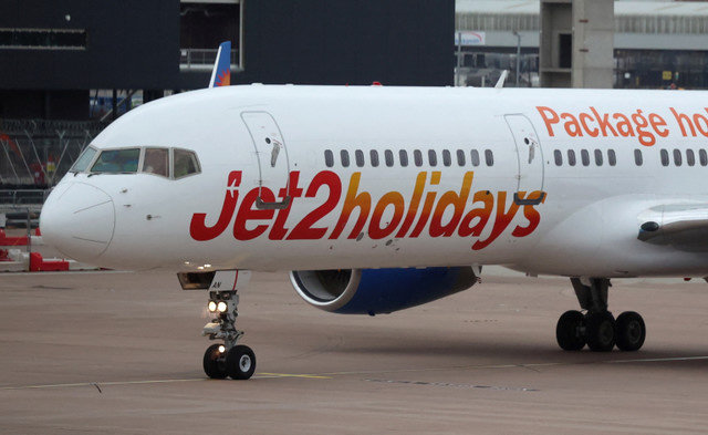 A Jet2 passenger plane is seen on the apron of Manchester Airport in Manchester, Britain, October 15, 2024. REUTERS/Phil Noble