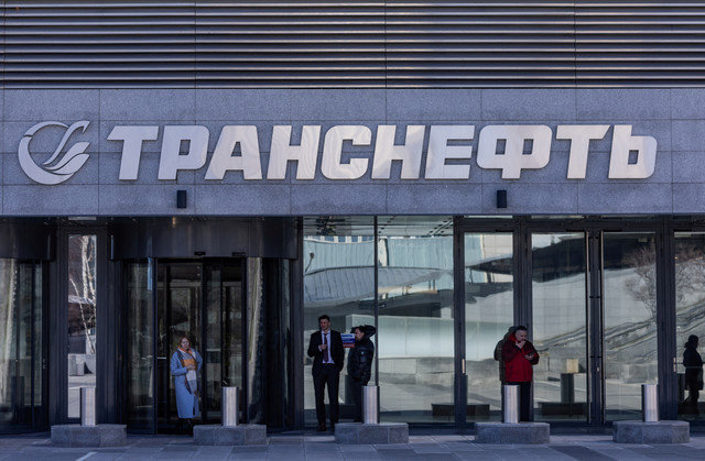 People stand next to an office of Transneft in Moscow, Russia, on April 14, 2022. REUTERS/Maxim Shemetov/File Photo