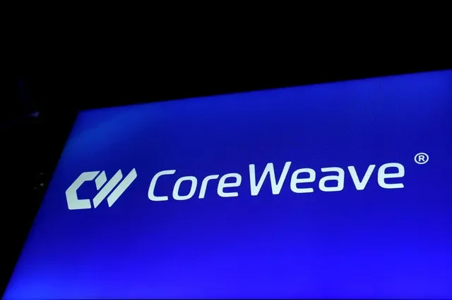 The CoreWeave, Inc. logo is displayed on a screen at the Nasdaq Market in New York City during the company's initial public offering on March 28, 2025. REUTERS/Brendan McDermid