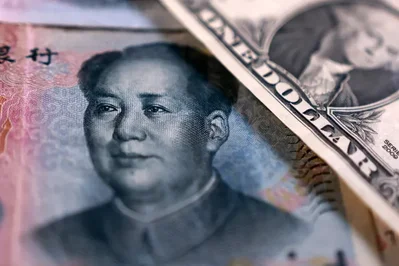 PBOC Scraps FX Risk Reserves to Lower Dollar Buying Costs