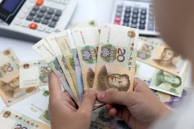 Dollar records monthly gain as China slows yuan rally